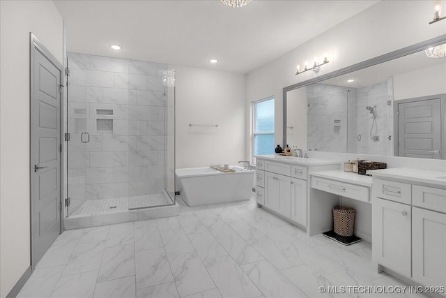 4255 S 173rd E Ave, Tulsa, OK 74134 - full bath with marble look tile flooring, a freestanding tub, a shower stall, vanity, and recessed lighting