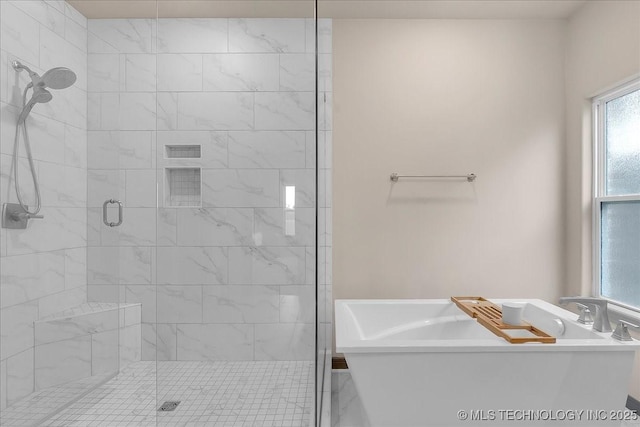 4255 S 173rd E Ave, Tulsa, OK 74134 - bathroom featuring a shower stall and a freestanding bath
