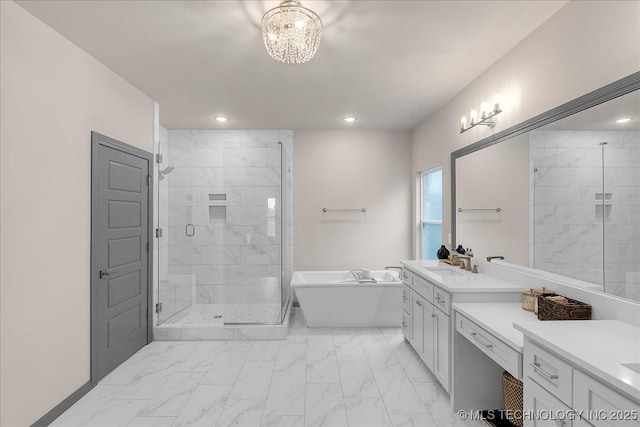 4255 S 173rd E Ave, Tulsa, OK 74134 - full bath with marble finish flooring, a freestanding tub, a shower stall, vanity, and recessed lighting
