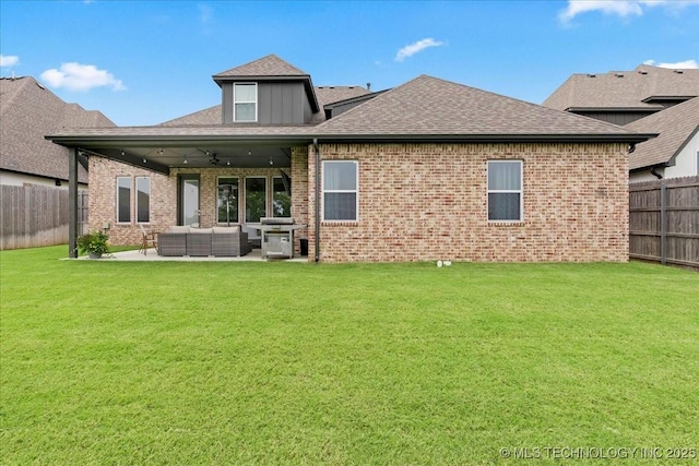 4255 S 173rd E Ave, Tulsa, OK 74134 - back of house with outdoor lounge area, a fenced backyard, a patio, and brick siding