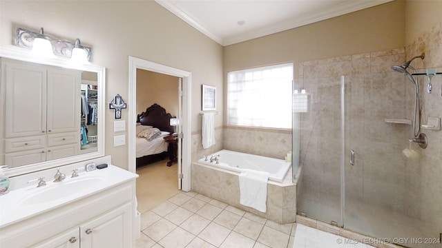 bathroom featuring tile patterned floors, vanity, ornamental molding, and shower with separate bathtub