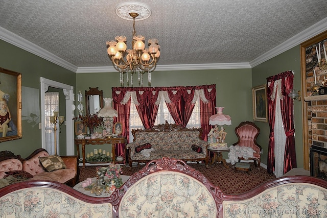 living room with a textured ceiling, a fireplace, crown molding, and an inviting chandelier