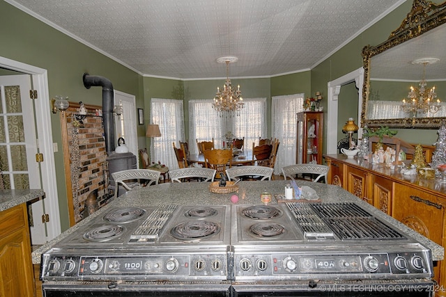 interior space featuring a wood stove, crown molding, a chandelier, a textured ceiling, and a breakfast bar area