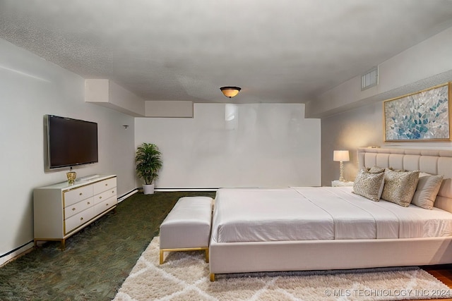 bedroom with dark colored carpet