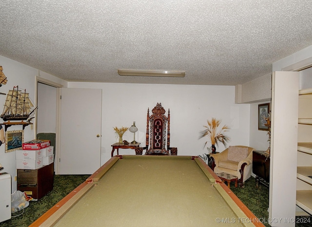 playroom with a textured ceiling and billiards