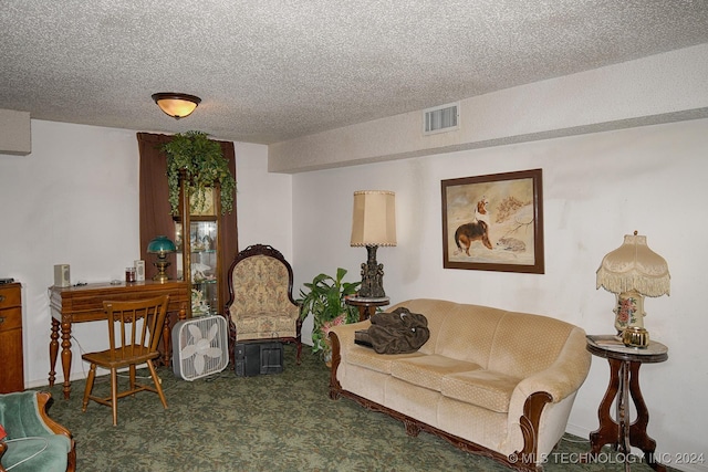 living area featuring carpet flooring and a textured ceiling