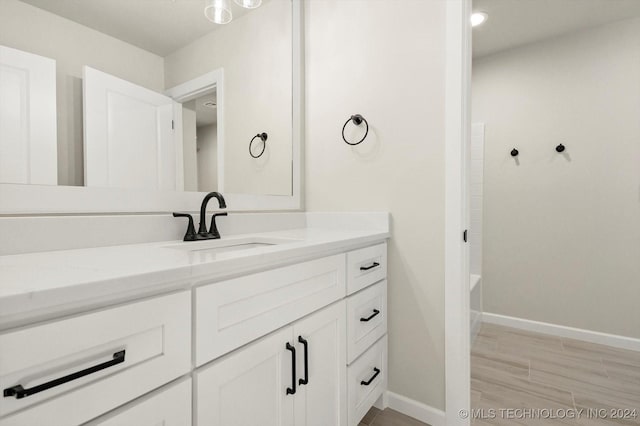 bathroom with shower / bathing tub combination and vanity