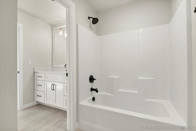 bathroom with tub / shower combination and vanity