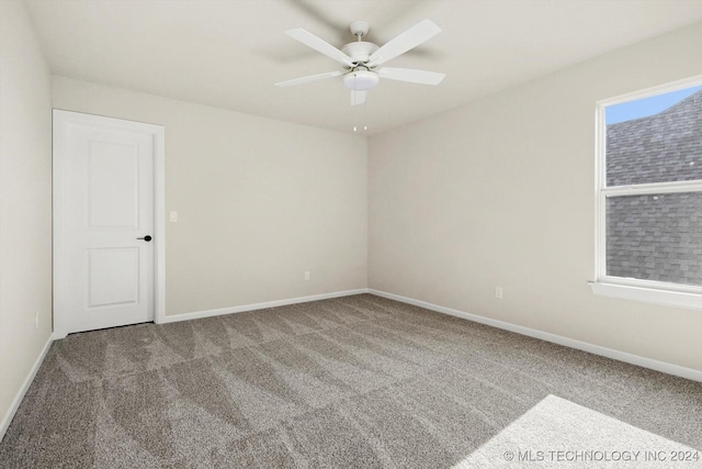 unfurnished room with ceiling fan and carpet flooring