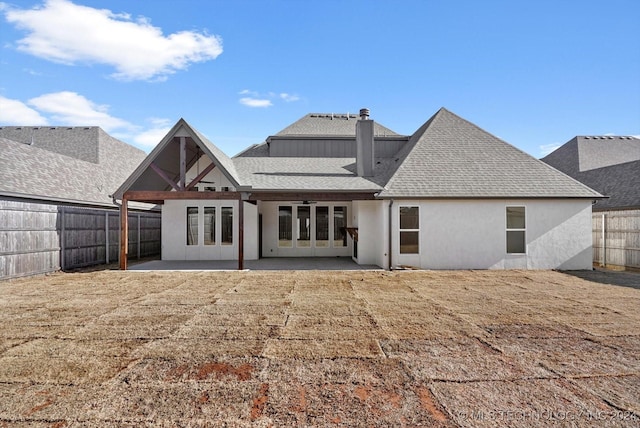 rear view of property featuring a patio area