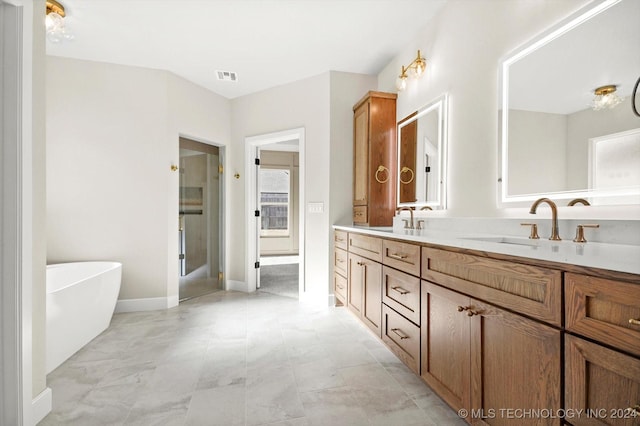 bathroom featuring vanity and a tub