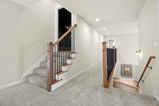 stairs with carpet flooring