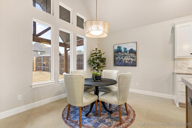 dining space featuring light tile patterned floors