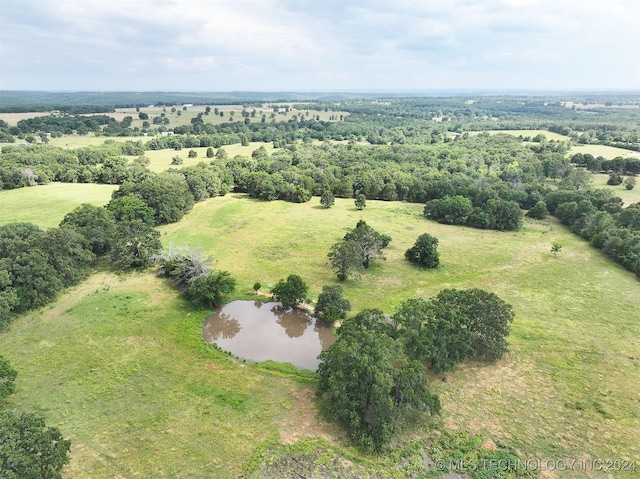 drone / aerial view with a rural view and a water view