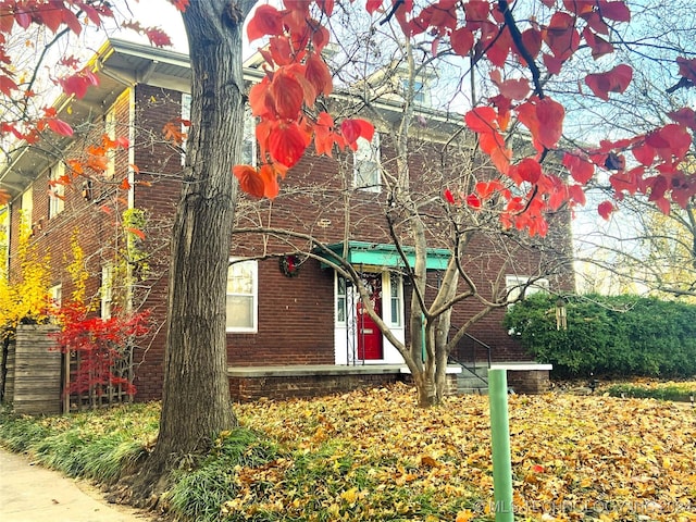 view of front of property featuring brick siding