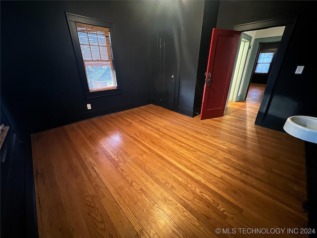 unfurnished bedroom with light wood-style flooring