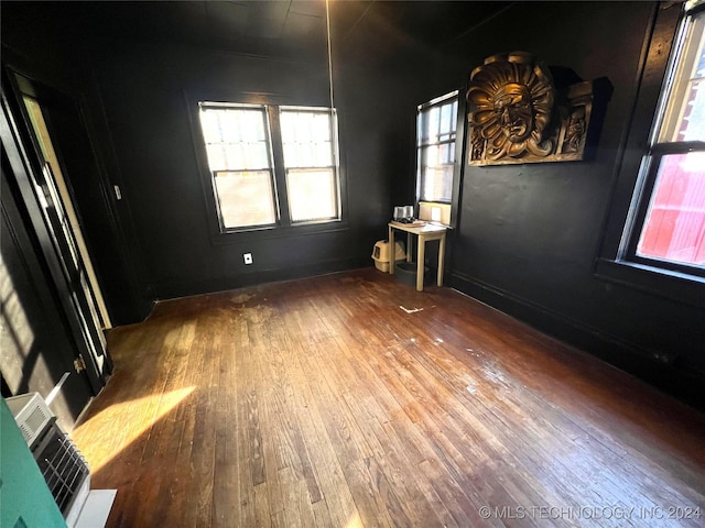 unfurnished room featuring hardwood / wood-style floors