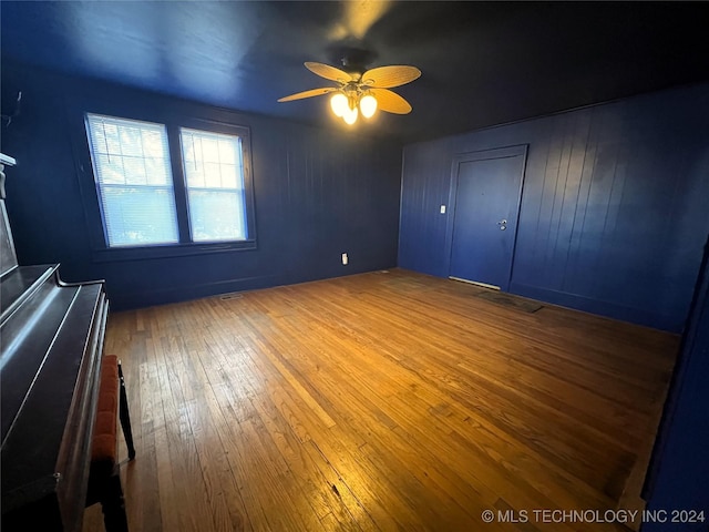 unfurnished bedroom featuring ceiling fan and wood-type flooring