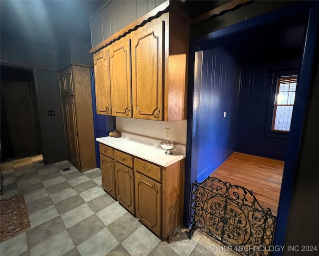 kitchen featuring brown cabinetry and light countertops