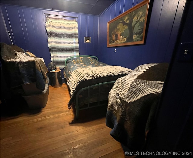 bedroom featuring wood finished floors