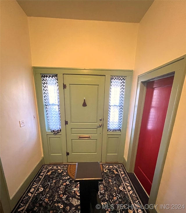 entryway with a wealth of natural light and baseboards