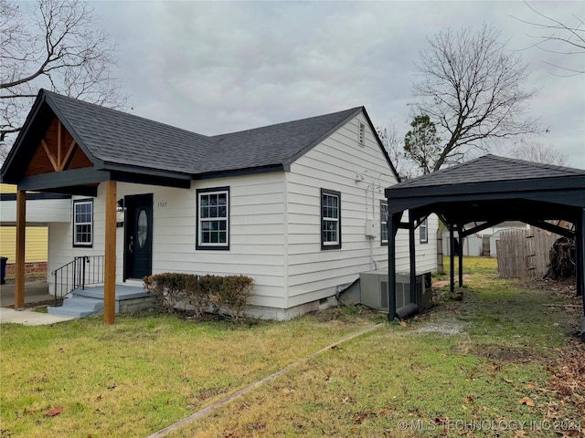 exterior space featuring a gazebo, a yard, and central air condition unit