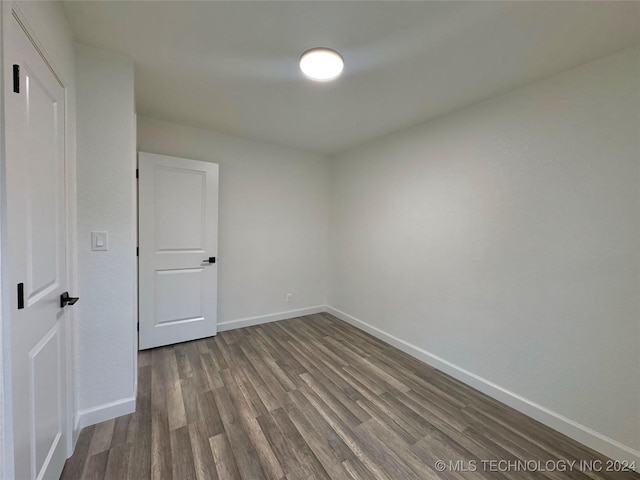 spare room with hardwood / wood-style flooring