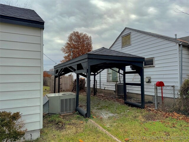 exterior space featuring a carport and central air condition unit