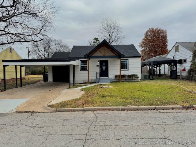 view of front of property with a gazebo, central AC, a front yard, and a carport