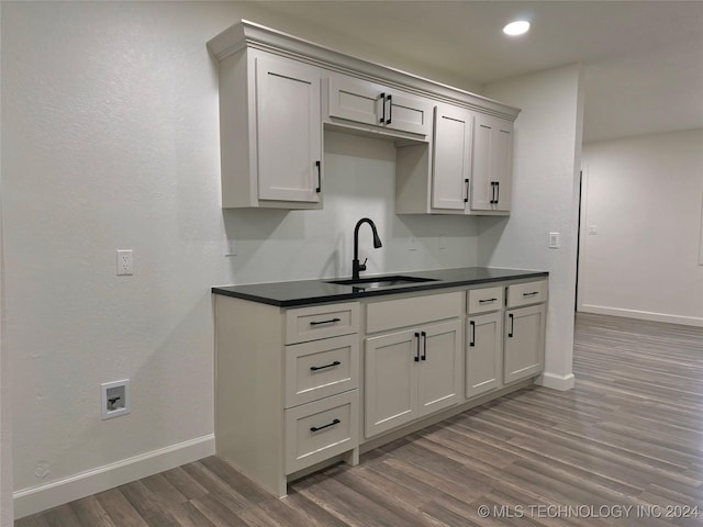 kitchen featuring dark hardwood / wood-style floors, gray cabinets, and sink