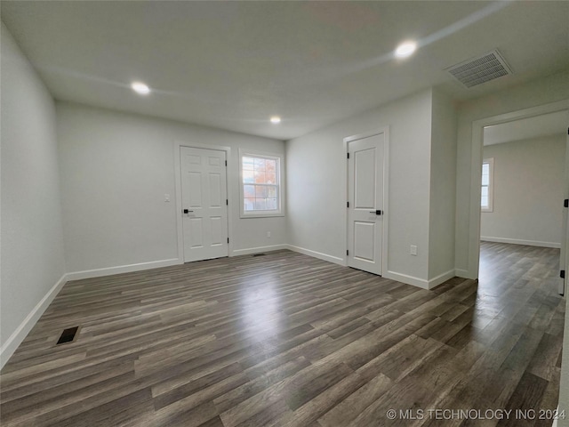 unfurnished room featuring dark hardwood / wood-style floors