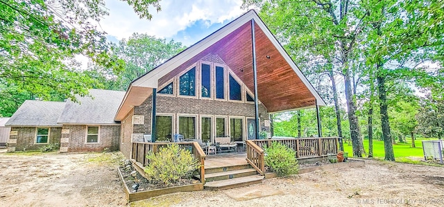 back of house featuring a deck