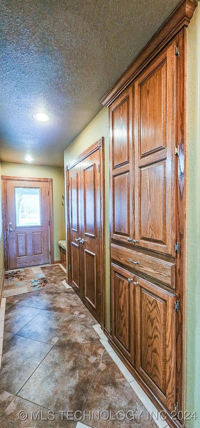 interior space featuring a textured ceiling