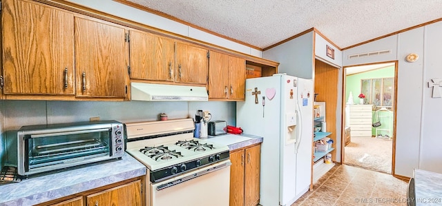 kitchen featuring ornamental molding, a textured ceiling, white appliances, vaulted ceiling, and light tile patterned floors