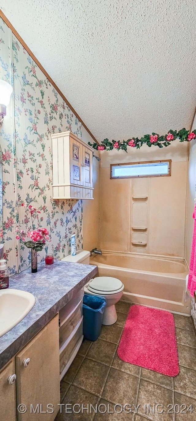 full bathroom featuring crown molding,  shower combination, a textured ceiling, toilet, and vanity