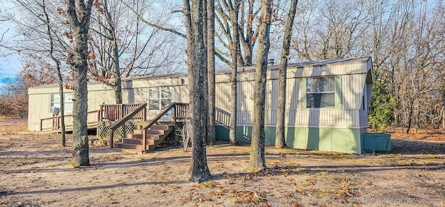 view of front facade featuring a wooden deck