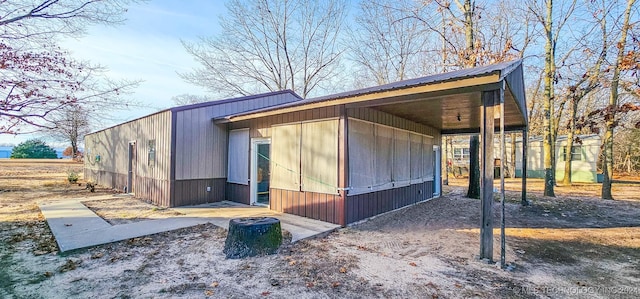 view of home's exterior with a carport