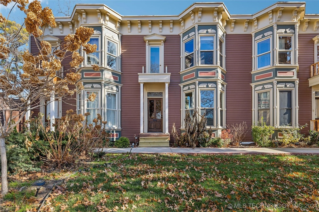 italianate house with a front yard