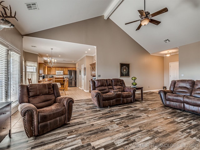 living room with beam ceiling, high vaulted ceiling, light hardwood / wood-style floors, ceiling fan with notable chandelier, and ornamental molding