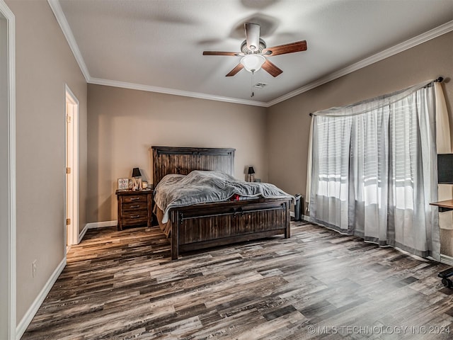 bedroom with crown molding, ceiling fan, and dark wood-type flooring