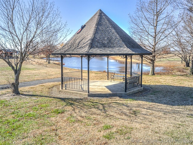 view of community with a gazebo and a water view