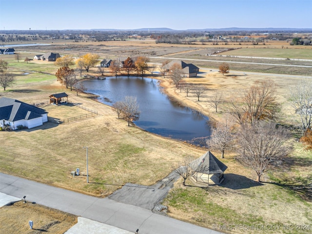 birds eye view of property with a rural view and a water view