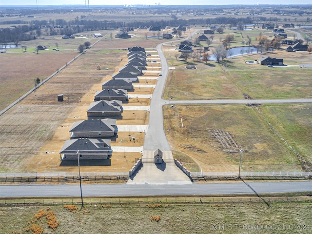 birds eye view of property with a rural view