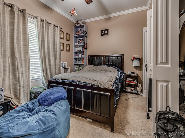 bedroom featuring multiple windows, ceiling fan, and ornamental molding