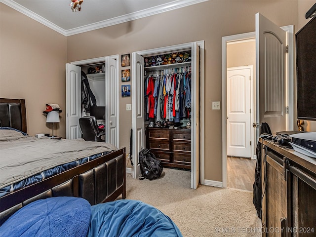 carpeted bedroom with ornamental molding