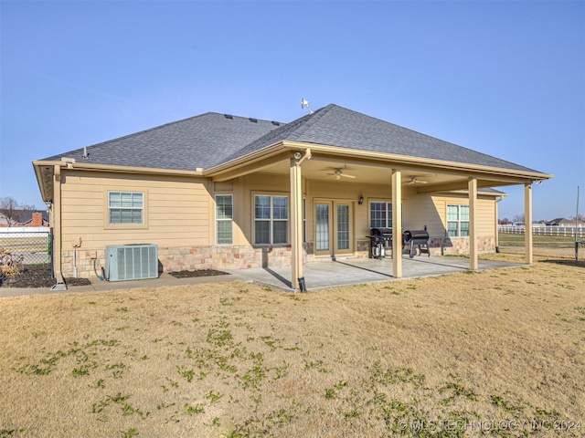 back of house with ceiling fan, a yard, a patio, and central AC unit