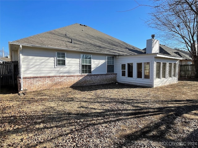 back of house with a sunroom