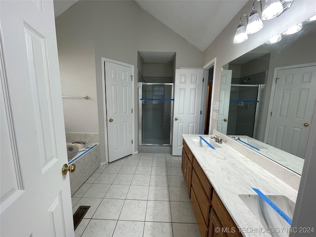 bathroom featuring tile patterned flooring, vanity, lofted ceiling, and shower with separate bathtub