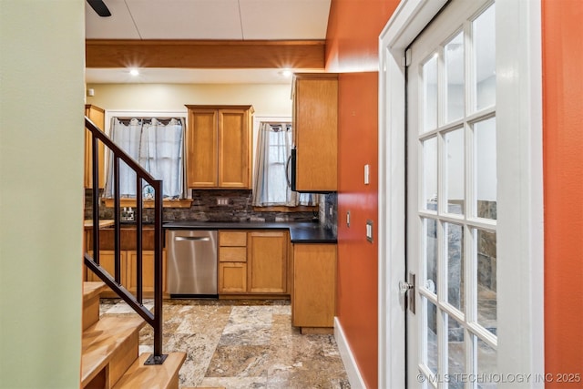 kitchen featuring tasteful backsplash and dishwasher