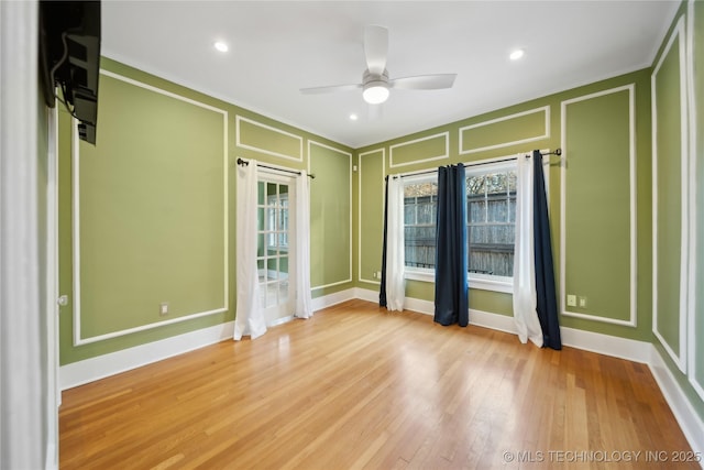 unfurnished room featuring ceiling fan and light hardwood / wood-style floors